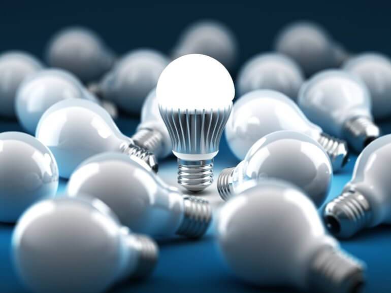 Images of LED light bulbs on a blue surface