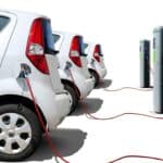 fleet of electric vehicles plugged in and charging