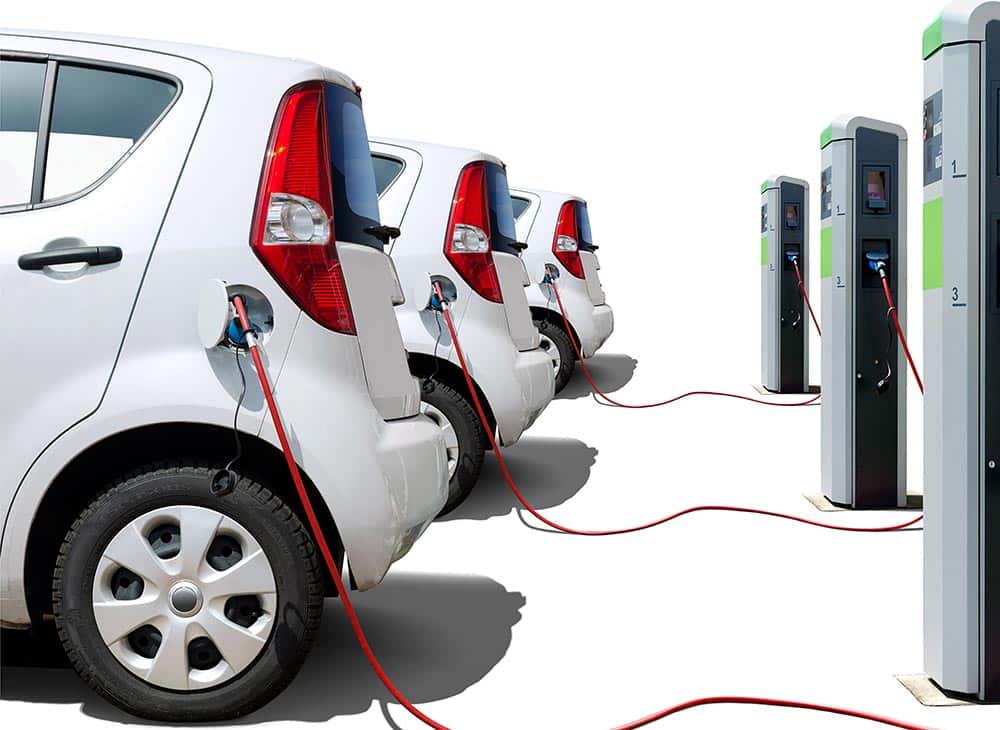 fleet of electric vehicles plugged in and charging