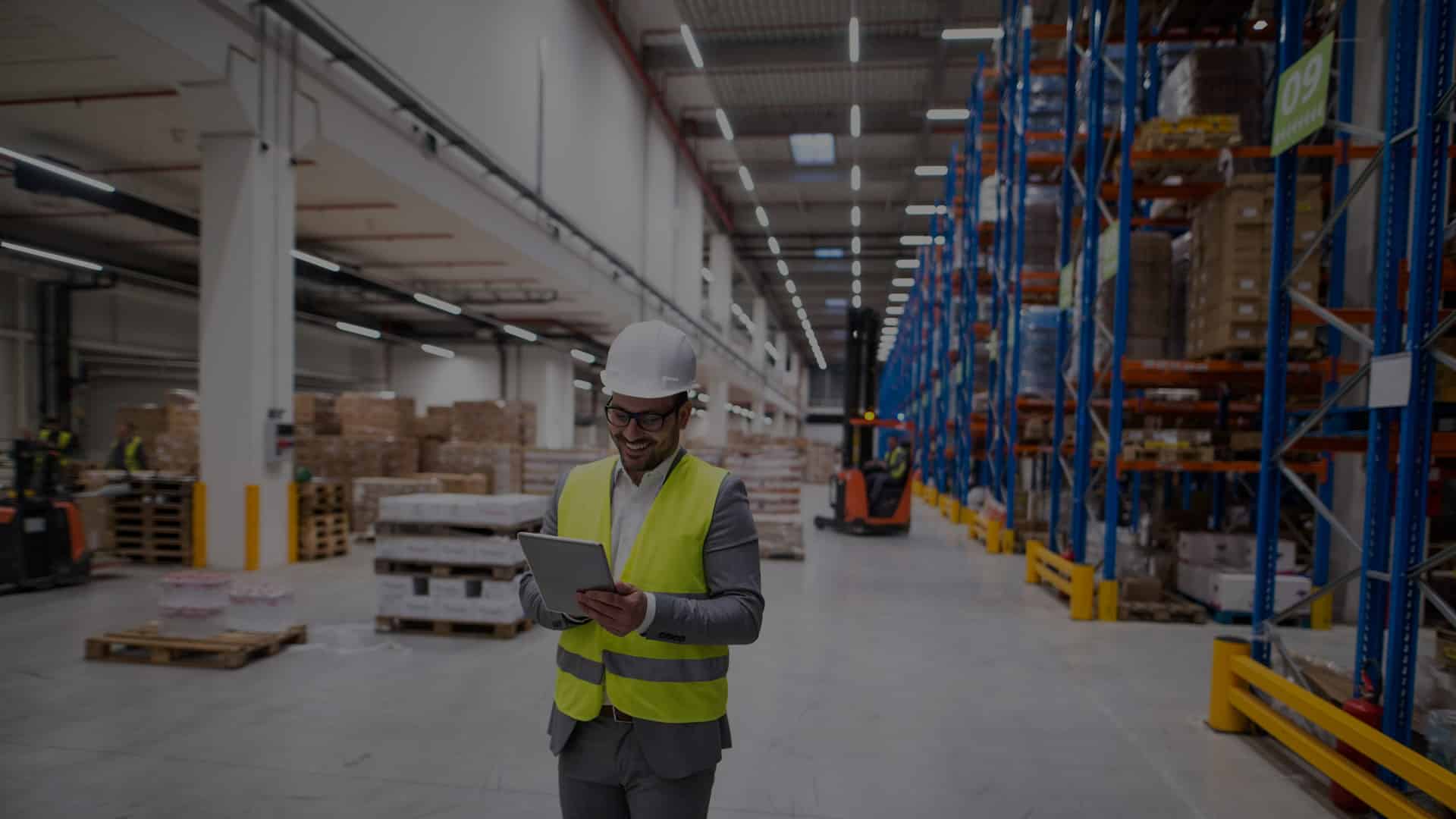 employee performing a lighting audit in a manufacturing plant