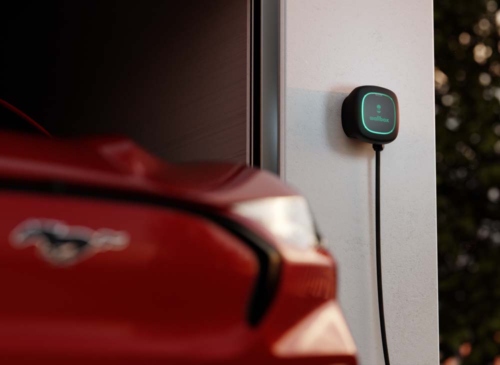 home EV charger mounted to wall