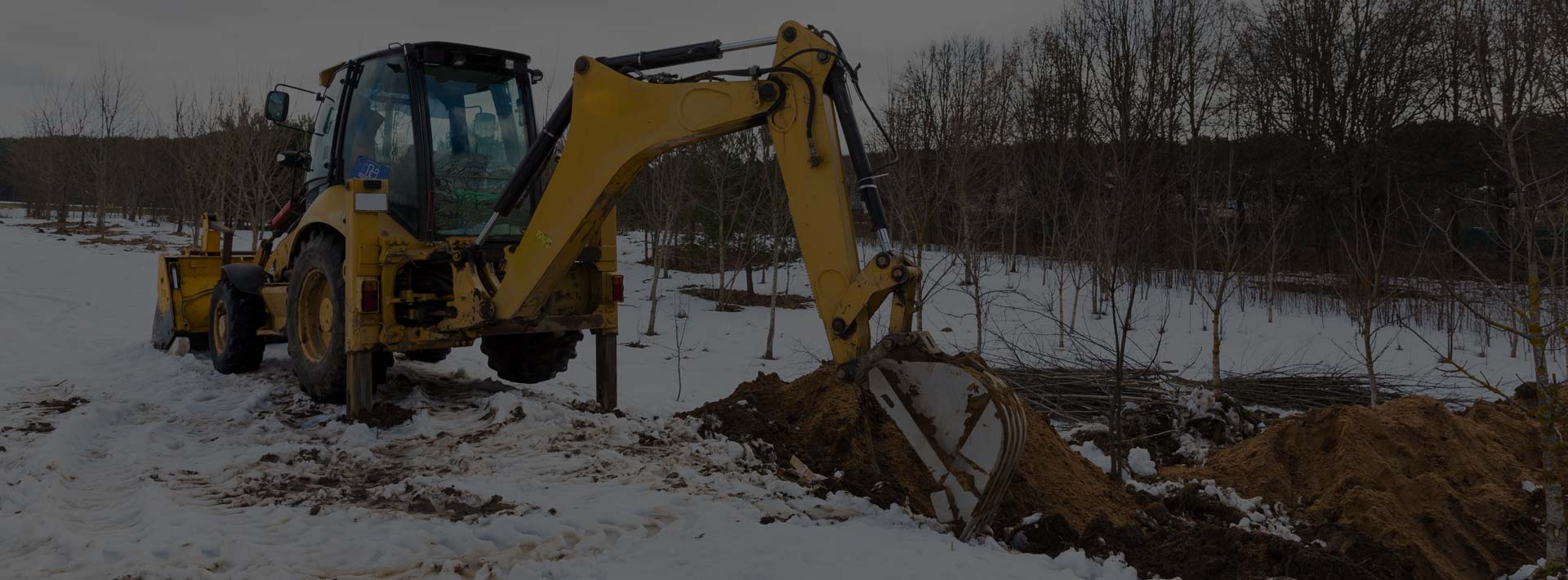construction equipment digging a trench for electrical