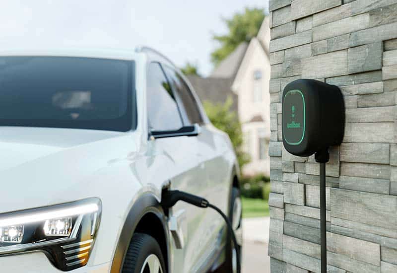 Wallbox Level 2 EV charger mounted to house